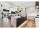 Open-concept kitchen with a large island offering seating, perfect for entertaining and daily meals at 1711 Brook Rd, Charlotte, NC 28205