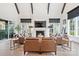 Spacious living area features high ceilings, exposed beams, fireplace, and hardwood floors at 1711 Brook Rd, Charlotte, NC 28205