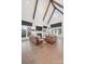 Spacious living room with cathedral ceiling, fireplace, and dark wood accent beams at 1711 Brook Rd, Charlotte, NC 28205