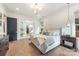Beautiful primary bedroom boasts a large bed, recessed lighting, and an en-suite bathroom at 1711 Brook Rd, Charlotte, NC 28205