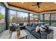 Covered patio with outdoor seating and a ceiling fan perfect for relaxing or entertaining guests at 1711 Brook Rd, Charlotte, NC 28205