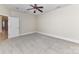 Bright bedroom featuring plush carpeting, neutral walls, and a ceiling fan at 178 Harper Lee St, Davidson, NC 28036