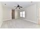 Spacious bedroom with plush carpeting, neutral walls, and a ceiling fan at 178 Harper Lee St, Davidson, NC 28036