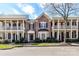 Brick townhomes feature multi-level porches with black shutters and blue accent doors at 178 Harper Lee St, Davidson, NC 28036