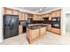 Gourmet kitchen featuring stainless steel appliances, custom cabinets, and granite countertops, creating a functional space at 178 Harper Lee St, Davidson, NC 28036