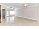 An expansive living room with tile flooring, plenty of natural light, and easy patio access at 178 Harper Lee St, Davidson, NC 28036