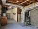 Unfinished basement with exposed ductwork, water heater, and utility systems at 1873 Rocky River Rd, Lancaster, SC 29720
