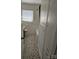Classic bathroom featuring black and white tile flooring, a bathtub with shower, and built-in storage at 1873 Rocky River Rd, Lancaster, SC 29720
