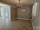 Dining room with stylish chandelier and view to sunroom at 1873 Rocky River Rd, Lancaster, SC 29720