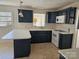Traditional kitchen with blue cabinets, white countertops, and modern appliances at 1873 Rocky River Rd, Lancaster, SC 29720