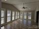 Sunroom with many windows and vaulted ceiling at 1873 Rocky River Rd, Lancaster, SC 29720