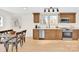 Bright dining room with table and chairs adjacent to kitchen at 188 Bailey Rd, Mooresville, NC 28117