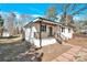 Exterior view of home with stained wood front porch and white siding at 188 Bailey Rd, Mooresville, NC 28117