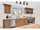 Kitchen boasts stainless steel appliances and wooden cabinets at 188 Bailey Rd, Mooresville, NC 28117