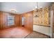 Dining space adjacent to living area, with wallpaper and wood paneling at 2039 Bangor Rd # 12, Charlotte, NC 28217