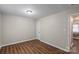 The bedroom features neutral walls, hardwood floors and an entrance to another room at 208 Tomberlin Rd, Mount Holly, NC 28120