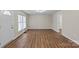 The living room features hardwood floors, a front door and a large window at 208 Tomberlin Rd, Mount Holly, NC 28120