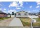 Charming single-story home showcasing a well-manicured lawn and a freshly poured concrete driveway at 2081 Montclair Dr, Rock Hill, SC 29732