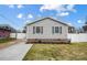 Attractive home with gray siding, a brick foundation, and landscaping, set against a bright, cloudy sky at 2081 Montclair Dr, Rock Hill, SC 29732