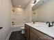 Modern bathroom with double vanity, sleek fixtures, and a shower and tub combo at 209 Halemarg Dr, Belmont, NC 28012