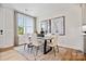 Bright dining area with neutral decor, large window, and modern art at 209 Halemarg Dr, Belmont, NC 28012