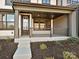 Inviting front porch of a townhome with dark trim, modern railing, and stylish entryway at 209 Halemarg Dr, Belmont, NC 28012