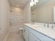 Functional bathroom featuring a double vanity, tub-shower combo, and neutral color scheme at 211 Halemarg Dr, Belmont, NC 28012