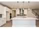 Modern kitchen featuring a large quartz island, stainless steel appliances, and stylish pendant lighting at 211 Halemarg Dr, Belmont, NC 28012