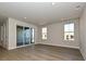 Bright and airy living room with large windows and sliding glass doors leading to outdoor space at 211 Halemarg Dr, Belmont, NC 28012