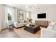 Bright and stylish living room featuring trendy furnishings and an open floor plan at 211 Halemarg Dr, Belmont, NC 28012