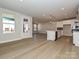 Open-concept living space with modern finishes, hardwood floors and lots of natural light at 211 Halemarg Dr, Belmont, NC 28012