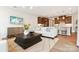 Stylishly decorated living room featuring trendy furnishings and an open flow into the kitchen at 211 Halemarg Dr, Belmont, NC 28012