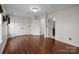 Large bedroom with wood floors and multiple closets and doors at 225 Lincoln St, Charlotte, NC 28203