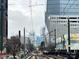 City view with train tracks, overhead power lines and buildings in the background at 225 Lincoln St, Charlotte, NC 28203