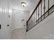 Inviting entryway with a staircase, tiled floor, and natural light from a window above the front door at 225 Lincoln St, Charlotte, NC 28203