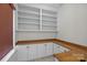 Home office with built-in cabinets, shelves, and counter space at 225 Lincoln St, Charlotte, NC 28203