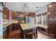 Modern kitchen featuring dark wood cabinets, granite countertops, stainless appliances, and a center island at 225 Lincoln St, Charlotte, NC 28203