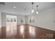 Spacious living room with hardwood floors, recessed lighting, and ample natural light at 225 Lincoln St, Charlotte, NC 28203