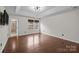 Primary bedroom with hardwood floors, recessed lights, and an attached bathroom at 225 Lincoln St, Charlotte, NC 28203
