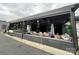 Outdoor patio with comfortable seating, heaters, and greenery for a relaxed atmosphere at 225 Lincoln St, Charlotte, NC 28203