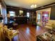 Formal living room with hardwood floors, dark walls, a fireplace and intricate details at 322 4Th Sw St, Hickory, NC 28602