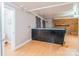 Finished basement area featuring tiled ceiling, brick fireplace and kitchenette at 406 Forest Dr, York, SC 29745