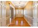 Elegant foyer featuring a chandelier, hardwood floors, and decorative wainscotting at 406 Forest Dr, York, SC 29745