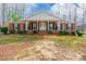 Charming single-story brick home with black shutters, landscaped yard, and inviting entrance at 406 Forest Dr, York, SC 29745