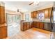 Bright kitchen featuring wood cabinets, stainless appliances, and sliding doors to outdoor deck at 406 Forest Dr, York, SC 29745