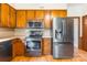 Kitchen with modern stainless steel appliances and wood cabinets at 406 Forest Dr, York, SC 29745