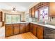 Kitchen with wood cabinets, hardwood floors, and a view of the backyard at 406 Forest Dr, York, SC 29745