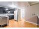 Kitchenette with a vintage stove and cabinetry leading to bathroom with shower at 406 Forest Dr, York, SC 29745