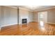 Elegant living room boasts a fireplace, hardwood floors, and bright, neutral tones at 406 Forest Dr, York, SC 29745