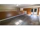 Finished basement features durable laminate flooring and back door at 601 Carole Ln, Charlotte, NC 28214